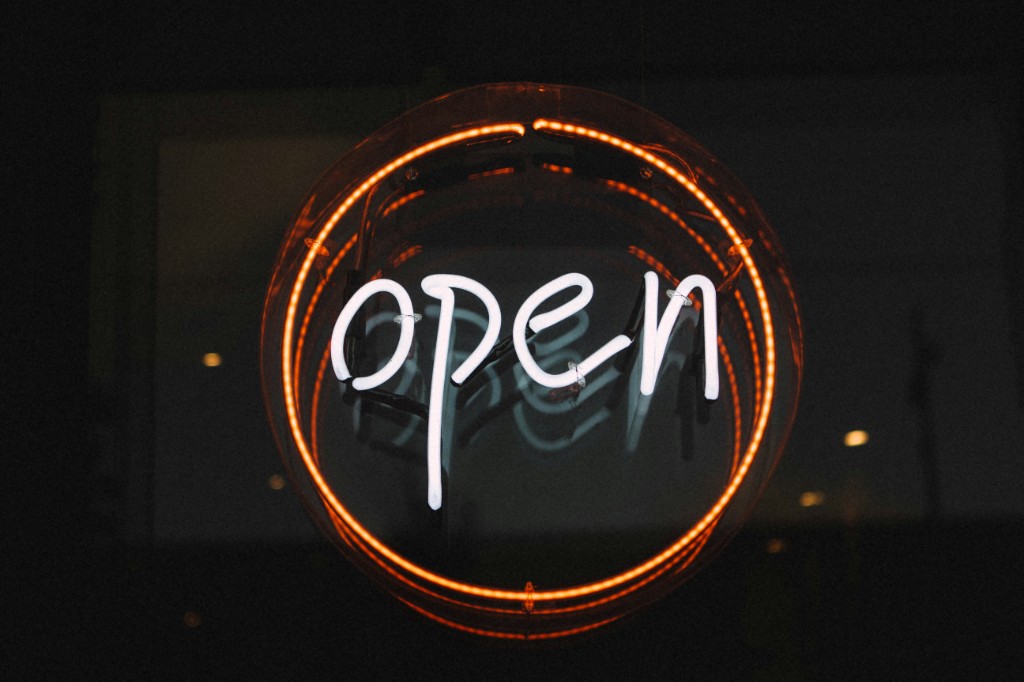 Neon sign spelling &lsquo;open&rsquo; in a circle, suggesting open government data